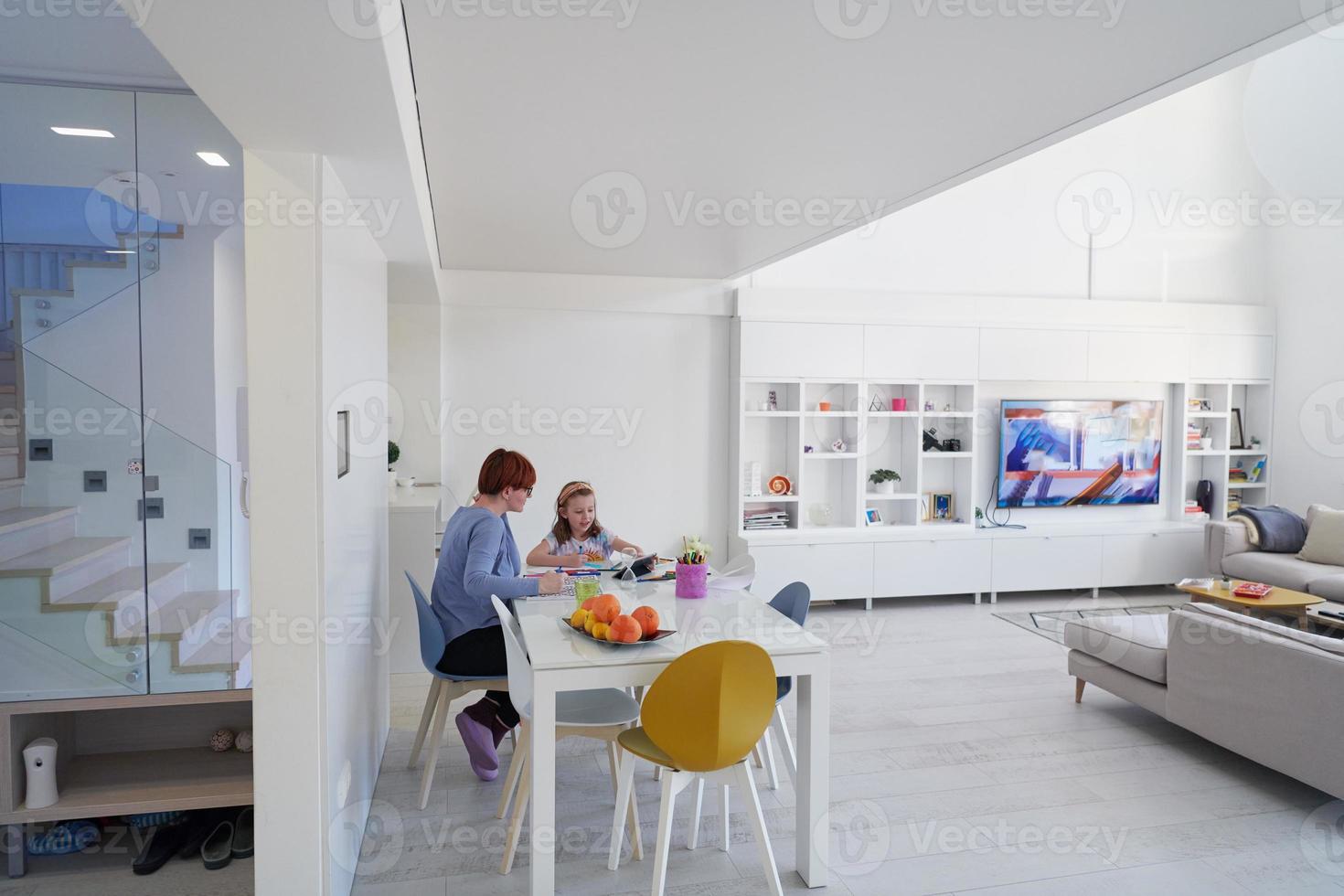 Mother and little daughter  playing together  drawing creative artwork photo