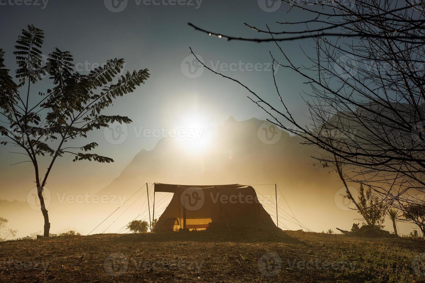 Tent in the morning in front of the mountains with cloud in natural park, Tourism concept photo