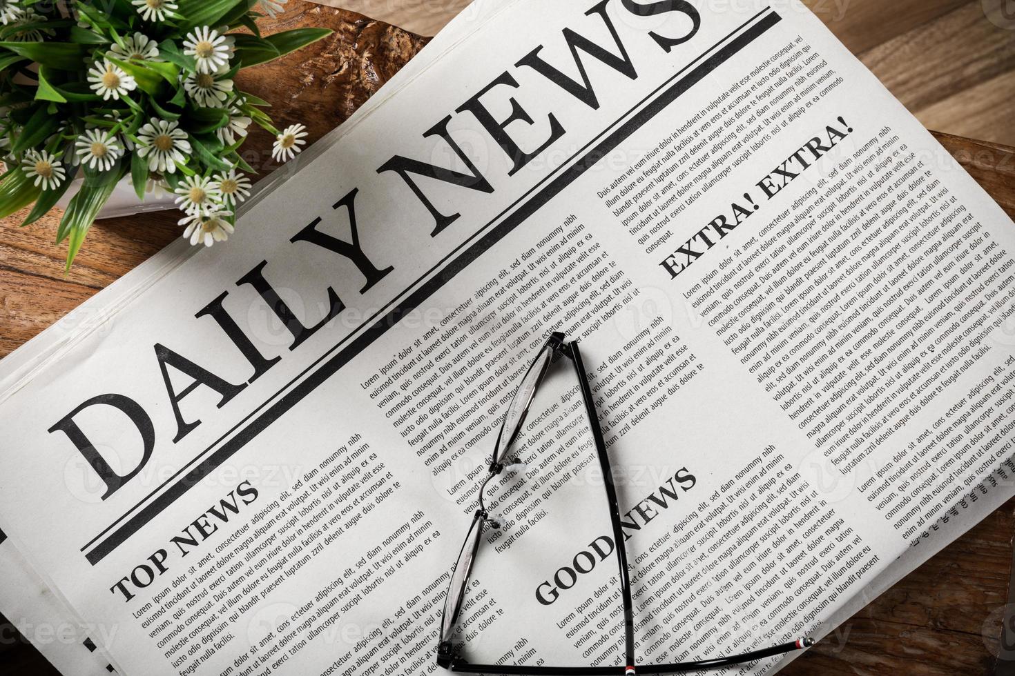 Newspaper with the headline News and glasses on wooden table, Daily Newspaper mock-up concept photo