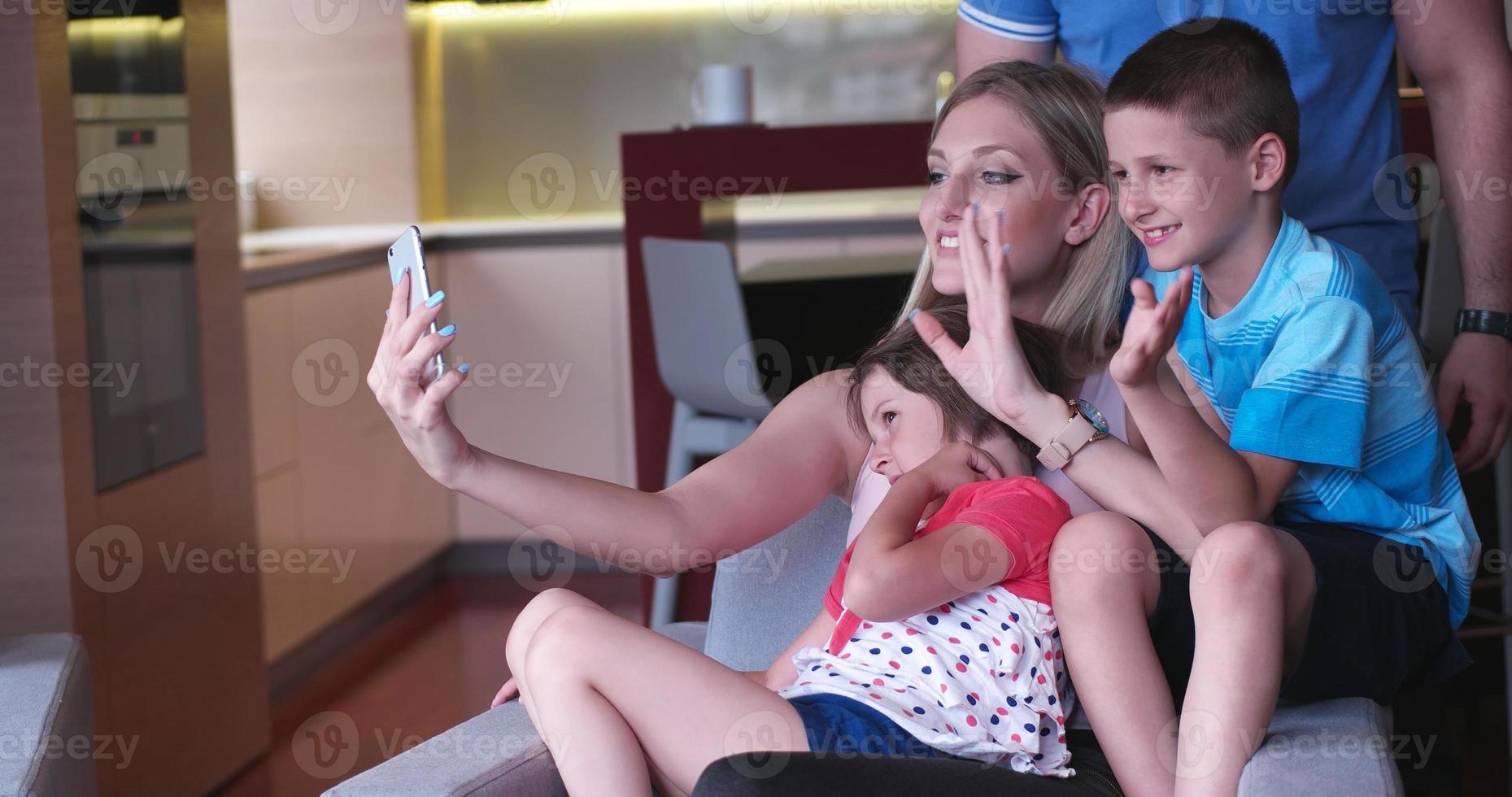 Family relaxing in living room photo