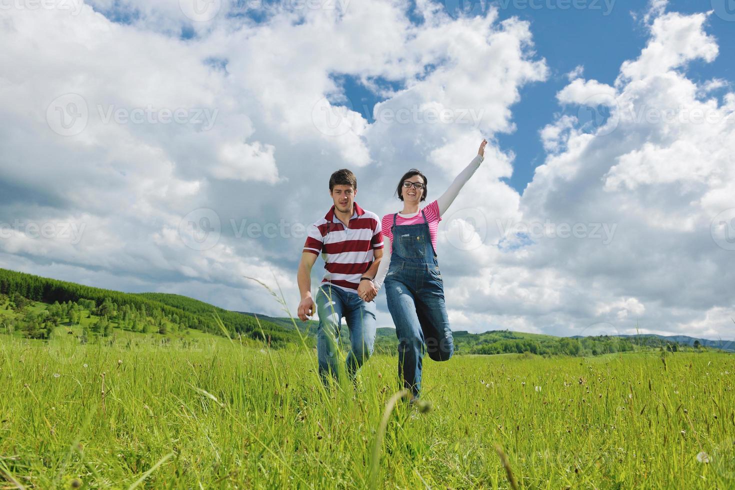 Portrait of romantic young couple smiling together outdoor photo