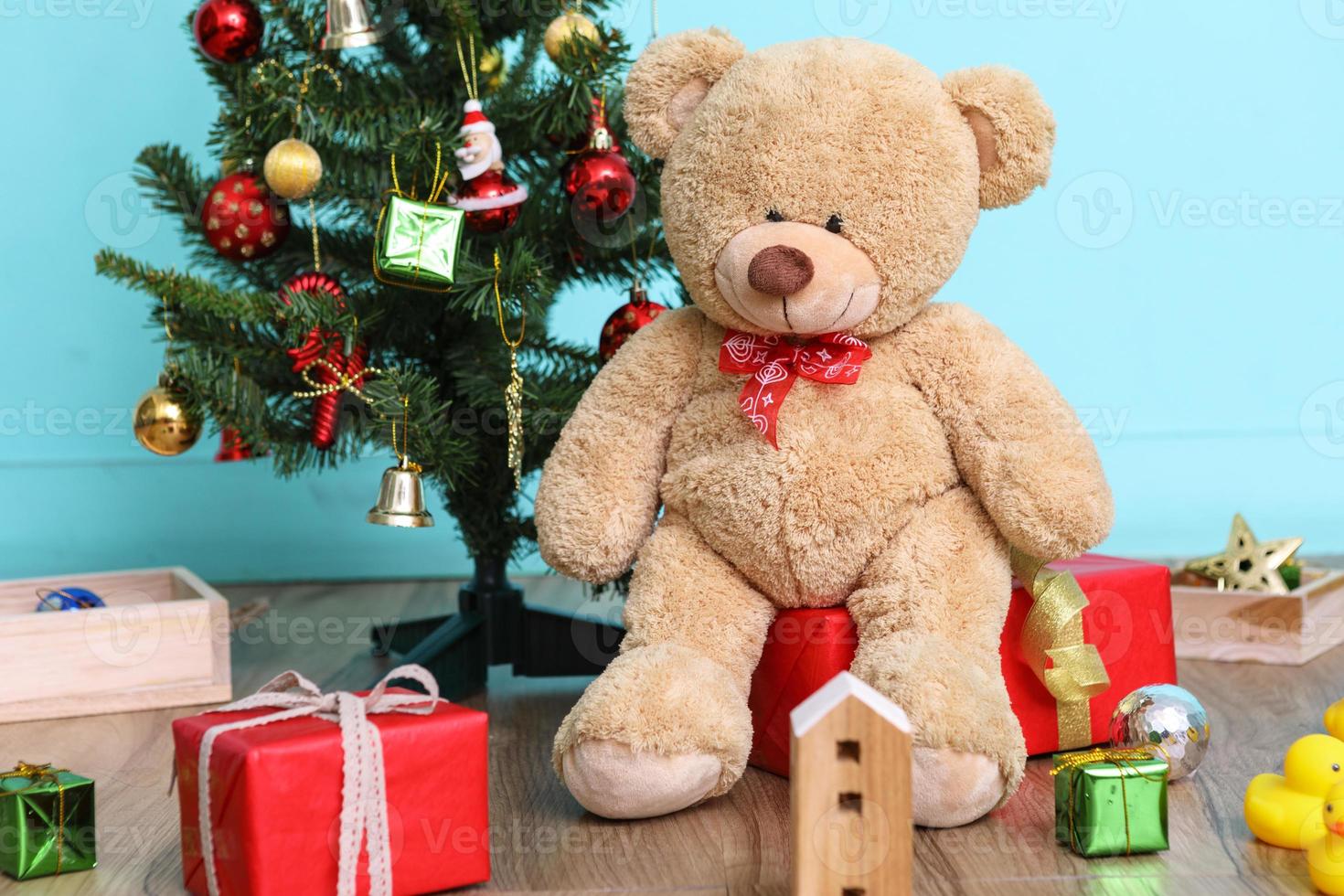 Christmas tree, flag and Christmas decorations with toy teddy bear on blue background, Happy New Year on 2017 photo