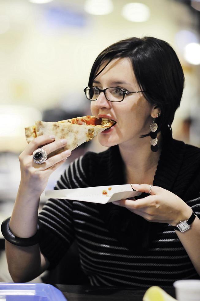 woman eat pizza food at restaurant photo