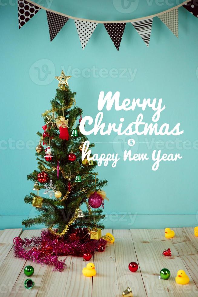 Christmas tree and Christmas decorations and text - Merry Christmas and Happy New Year photo