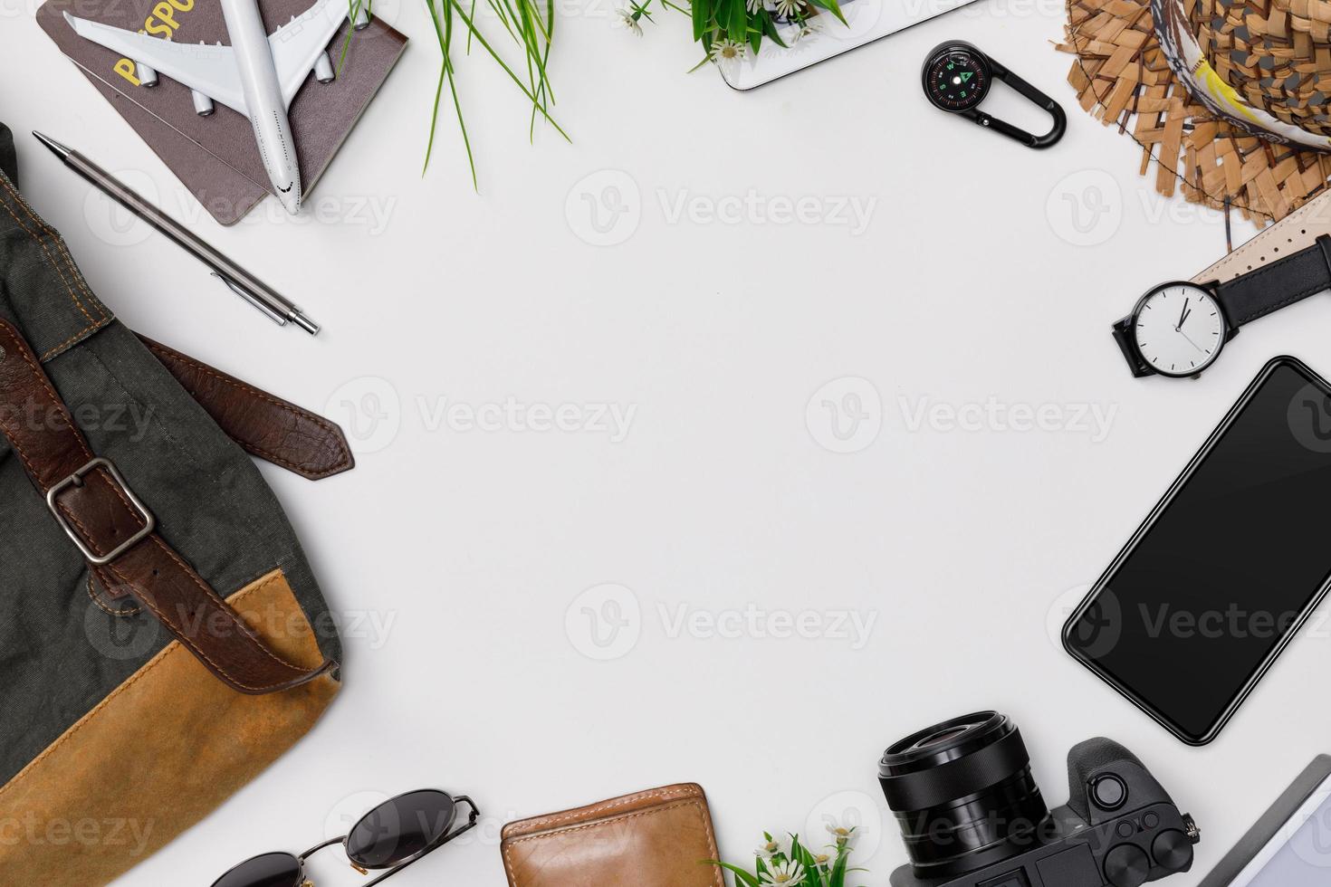 Top view mockup of Traveler's accessories with passport, books of travel plan, wallet, camera, hat, backpack and airplane toy isolated white background with empty space,Tropical travel concept photo
