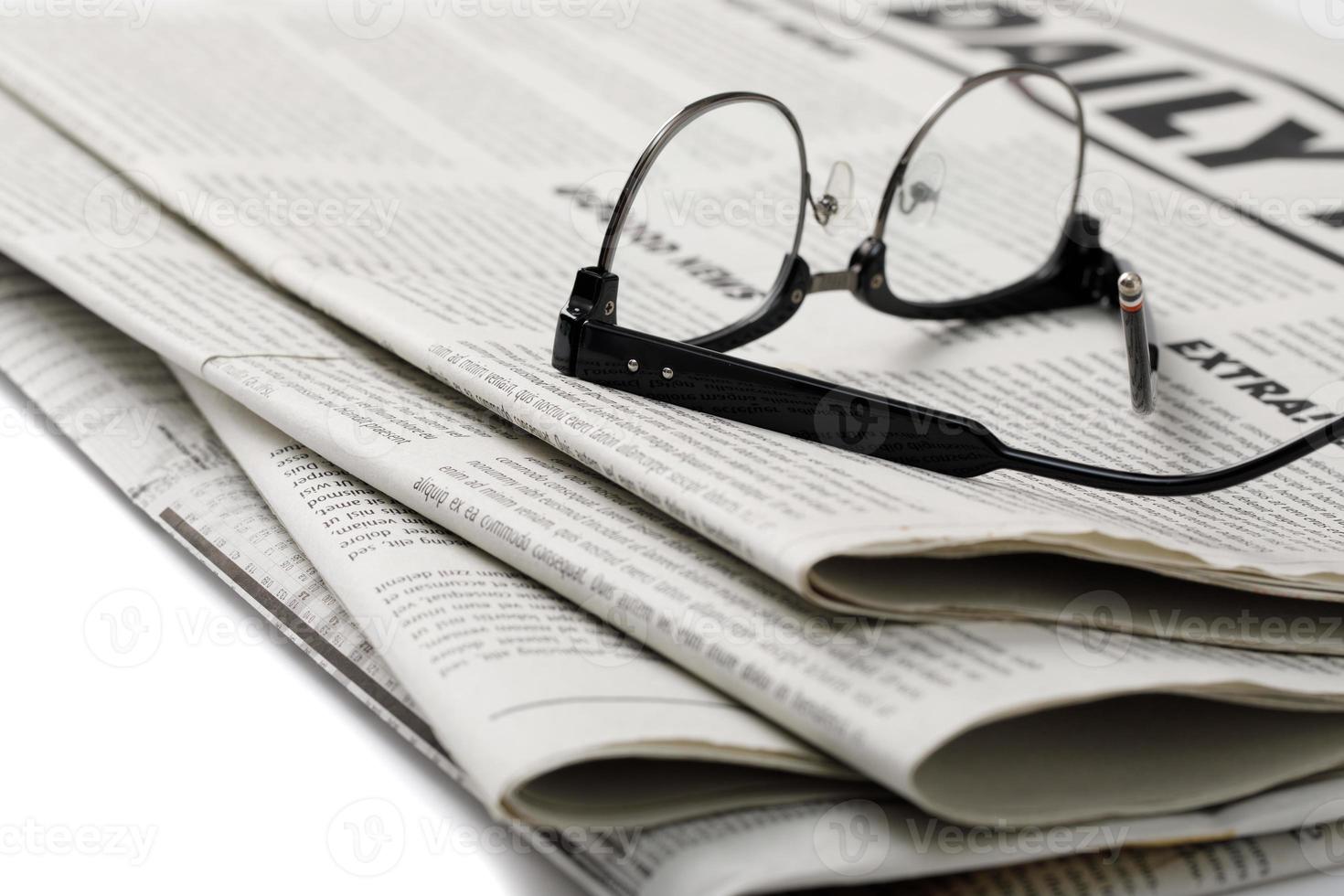 Mockup of Business Newspaper with glasses isolated on white background photo