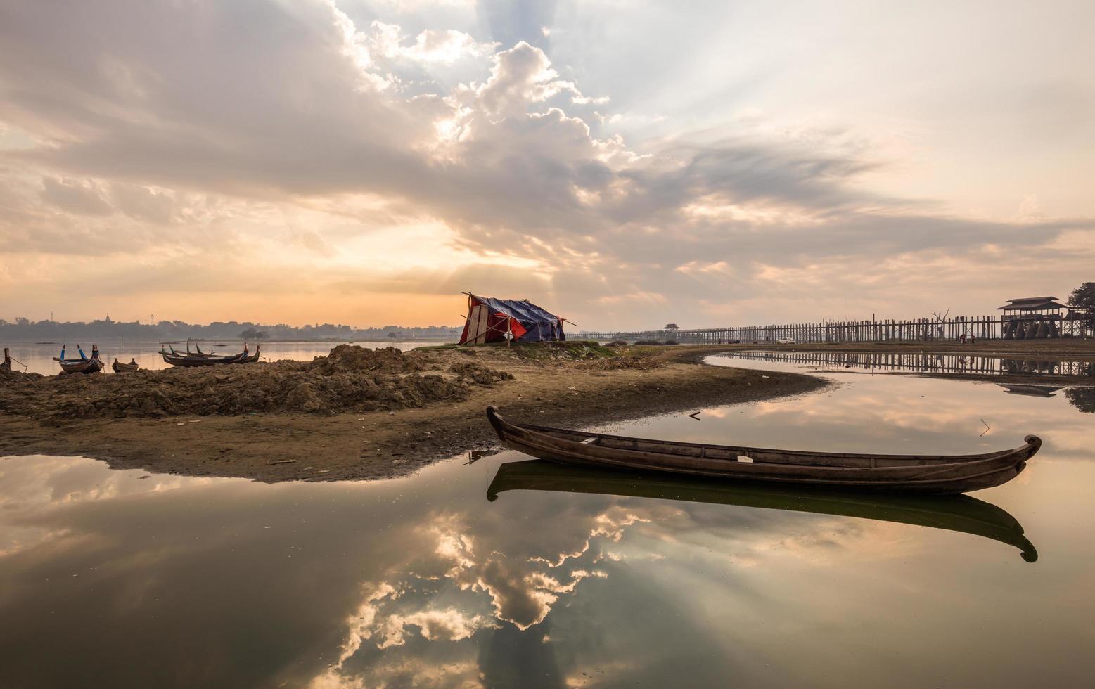 The beautiful sunrise over U Bein Bridge, Taungthaman Lake near Amarapura in Myanmar. photo