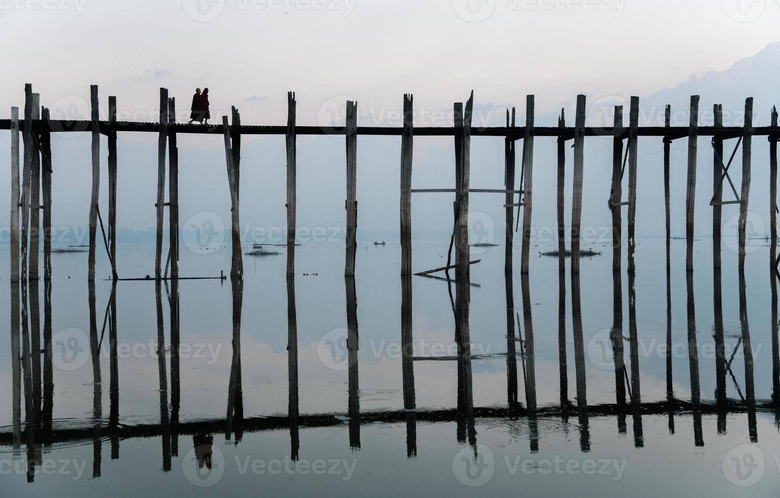 U Bein bridge the longest teak bridge in the world. U Bein Bridge is a crossing that spans the Taungthaman Lake near Amarapura in Myanmar. photo