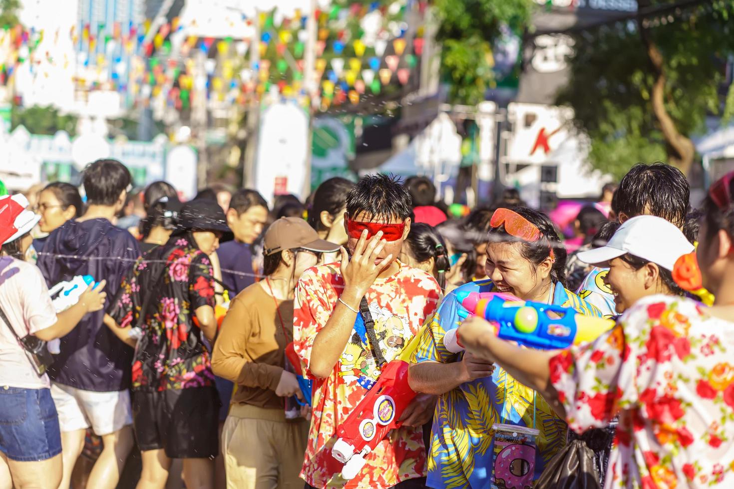 Siam Square, Bangkok, Thailand - APR 13, 2019 short action of people joins celebrations of the Thai New Year or Songkran in Siam Square. photo