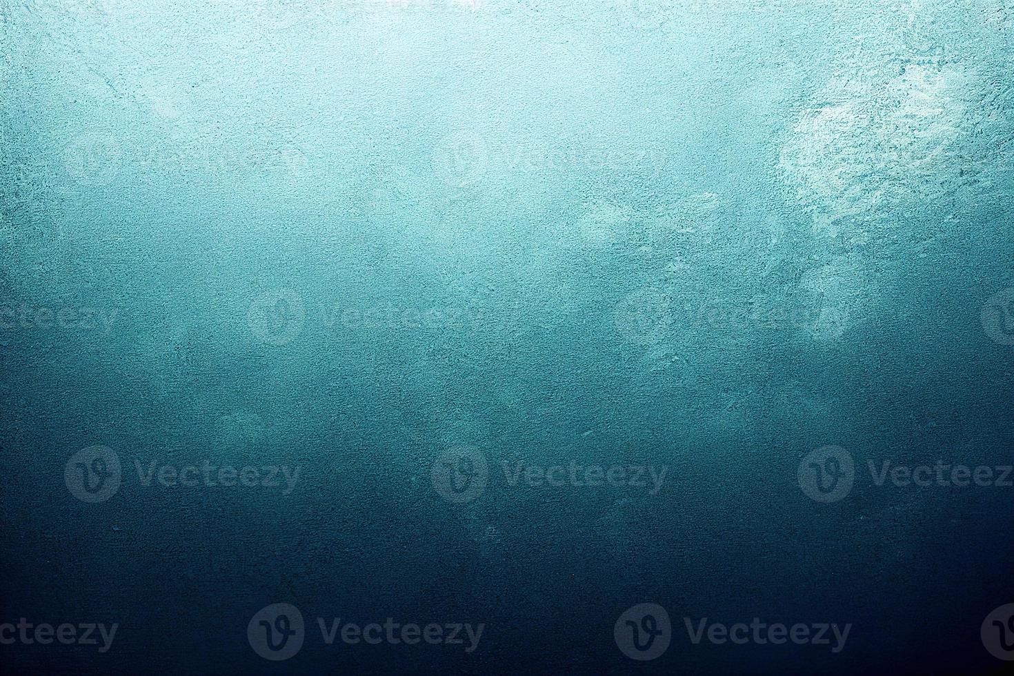 A computer generated illustration of a grunge wall surface texture background in blue, teal, turquoise colour. A.I. generated art. photo