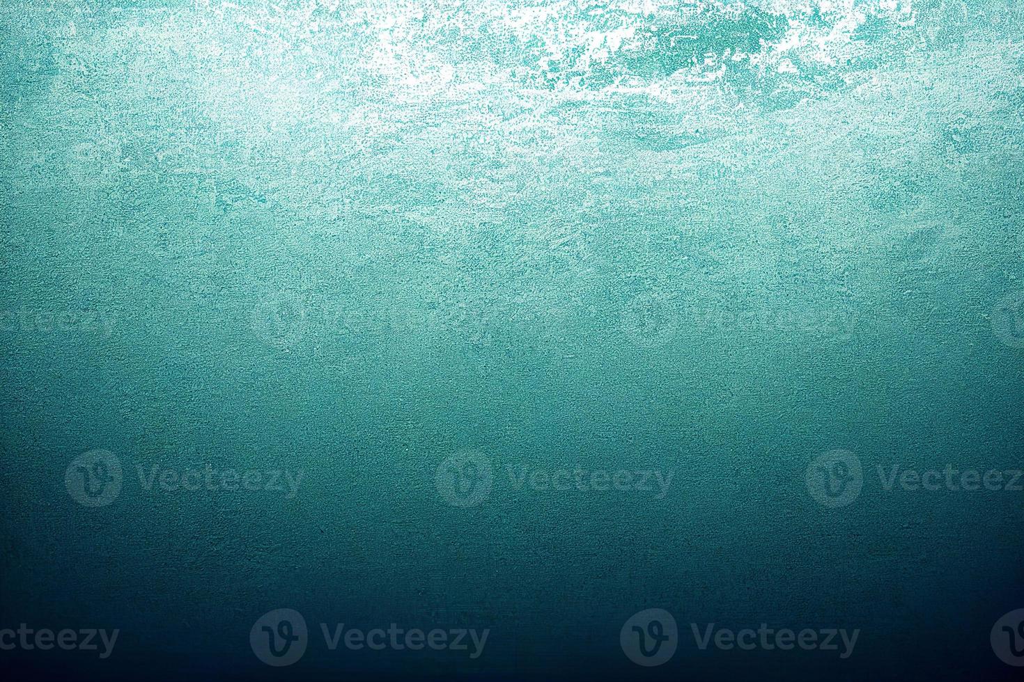 A computer generated illustration of a grunge wall surface texture background in blue, teal, turquoise colour. A.I. generated art. photo