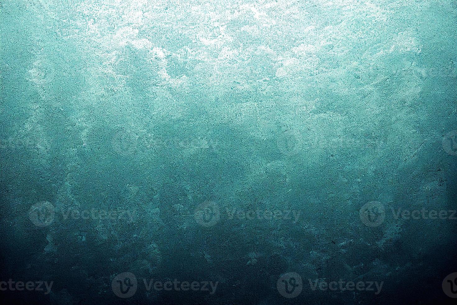 A computer generated illustration of a grunge wall surface texture background in blue, teal, turquoise colour. A.I. generated art. photo