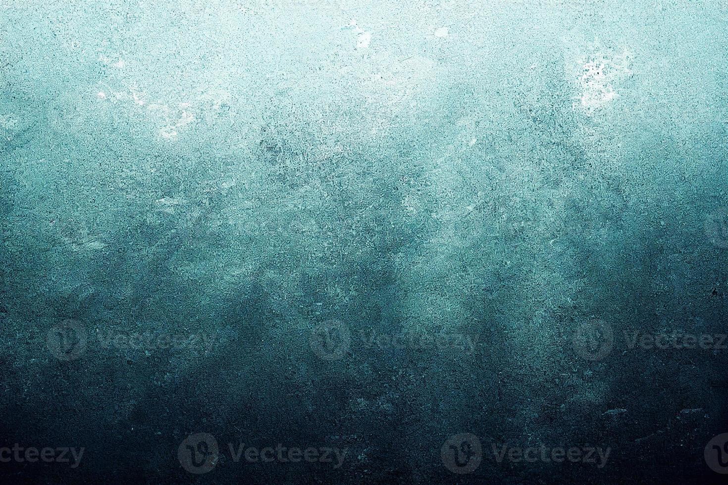 A computer generated illustration of a grunge wall surface texture background in blue, teal, turquoise colour. A.I. generated art. photo