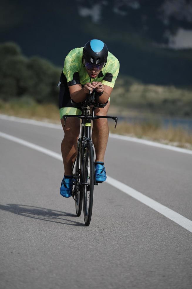 triathlon athlete riding bike photo