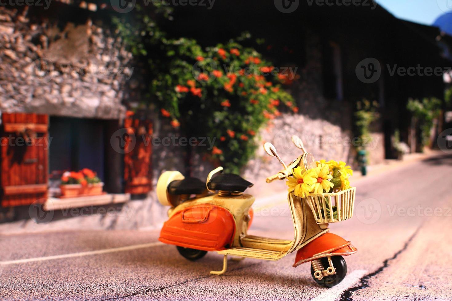 Vintage scooter with flowers on the street photo