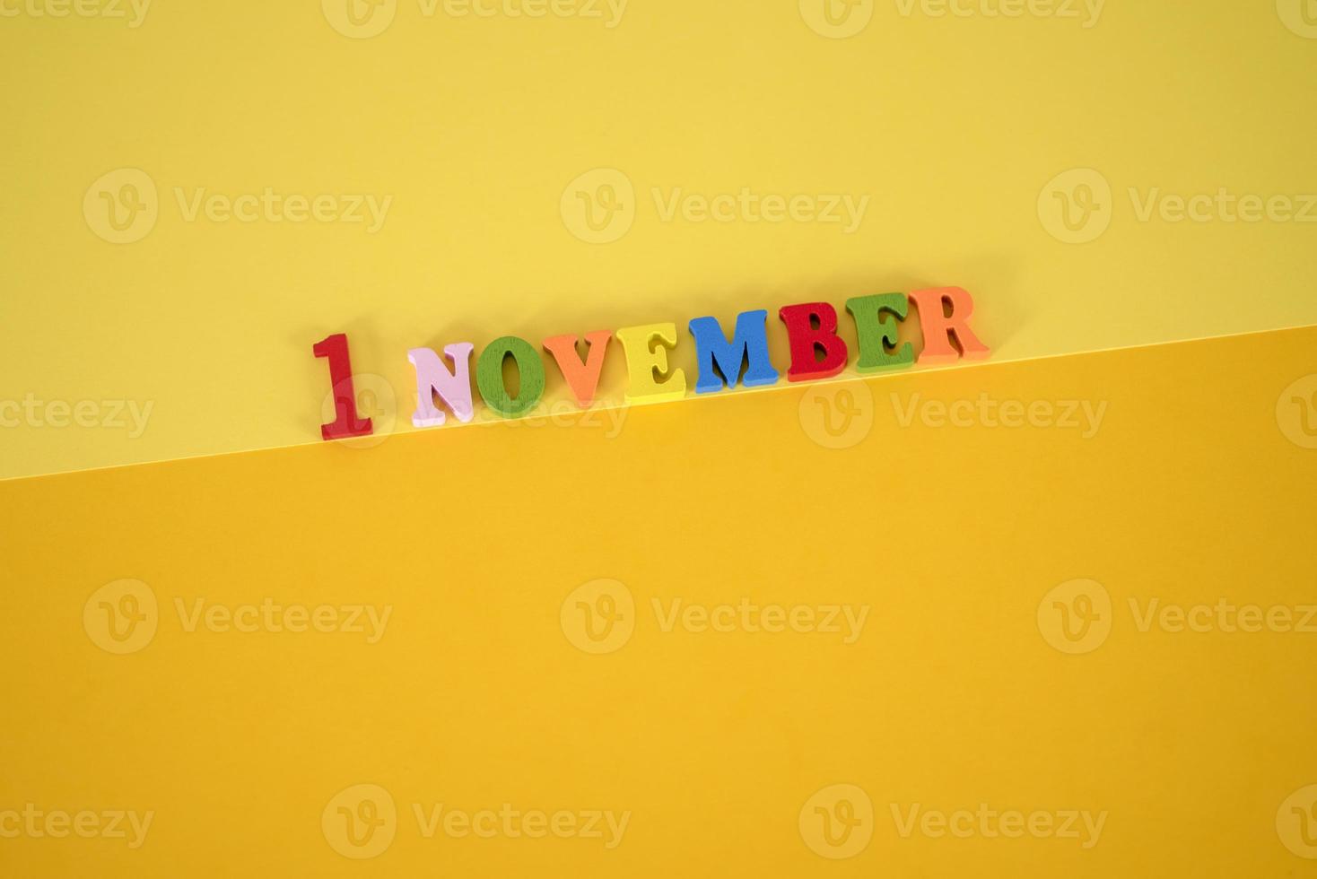 November 1st. Image of november 1 calendar on yellow background. Empty space for text photo