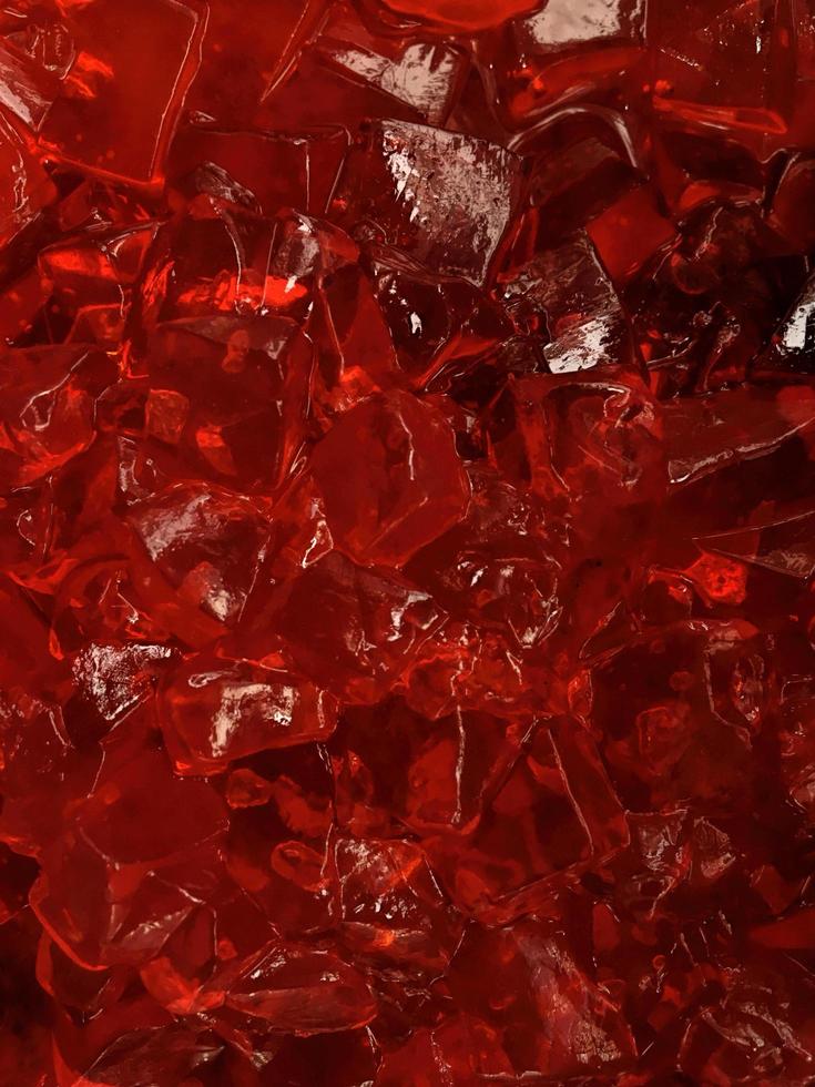 Heap of slices red jelly on white background photo