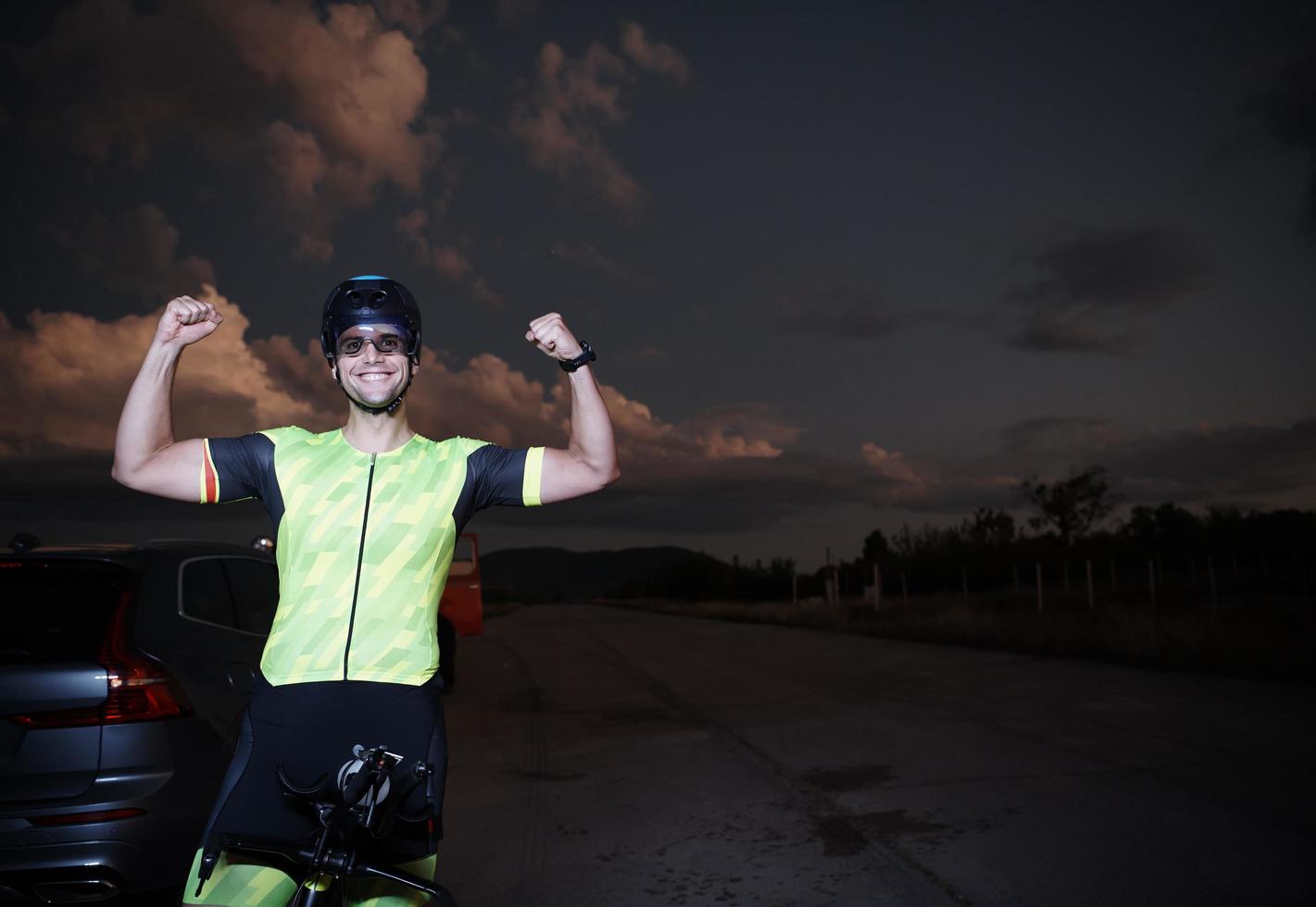 triathlon athlete portrait while resting on bike training photo