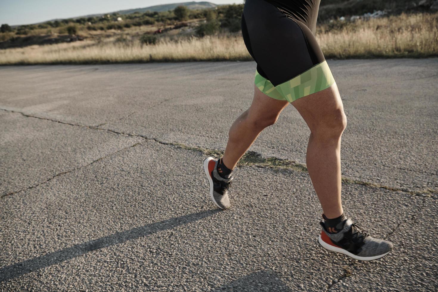 triathlon athlete running on morning trainig photo