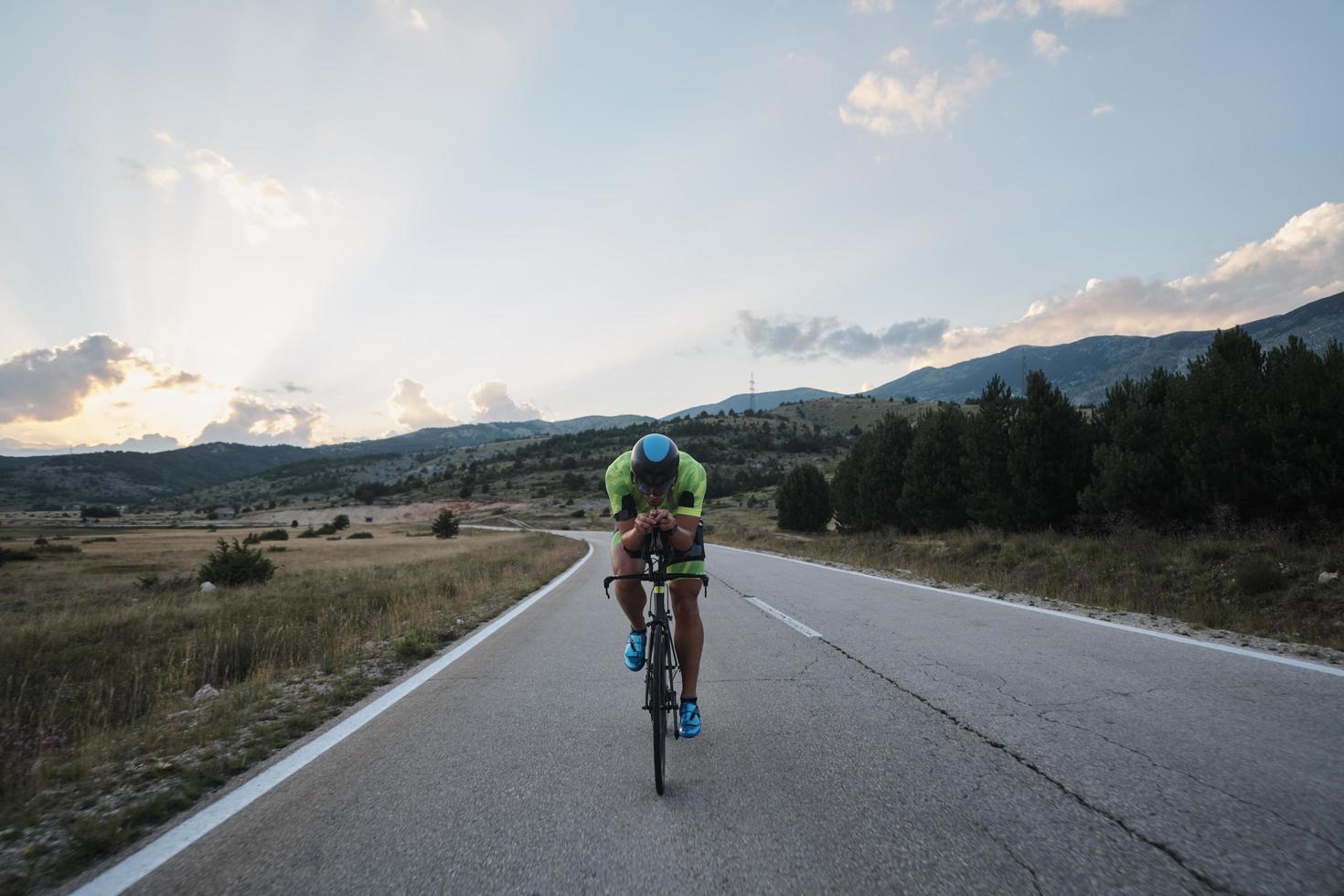 triathlon athlete riding bike photo