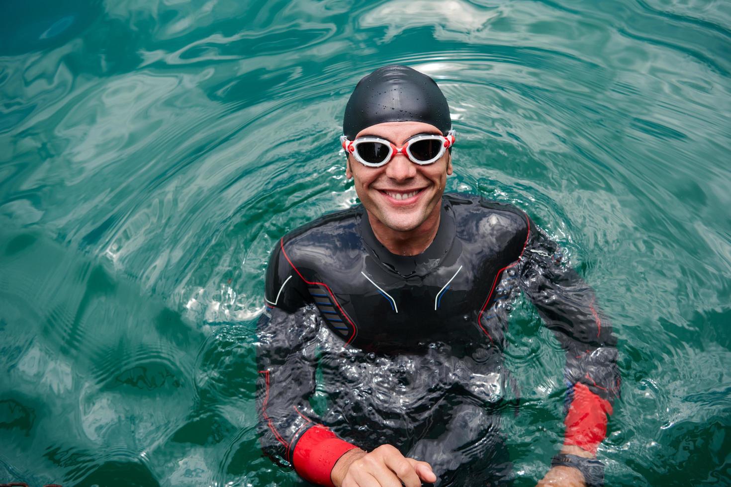 triathlete swimmer portrait wearing wetsuit on training photo