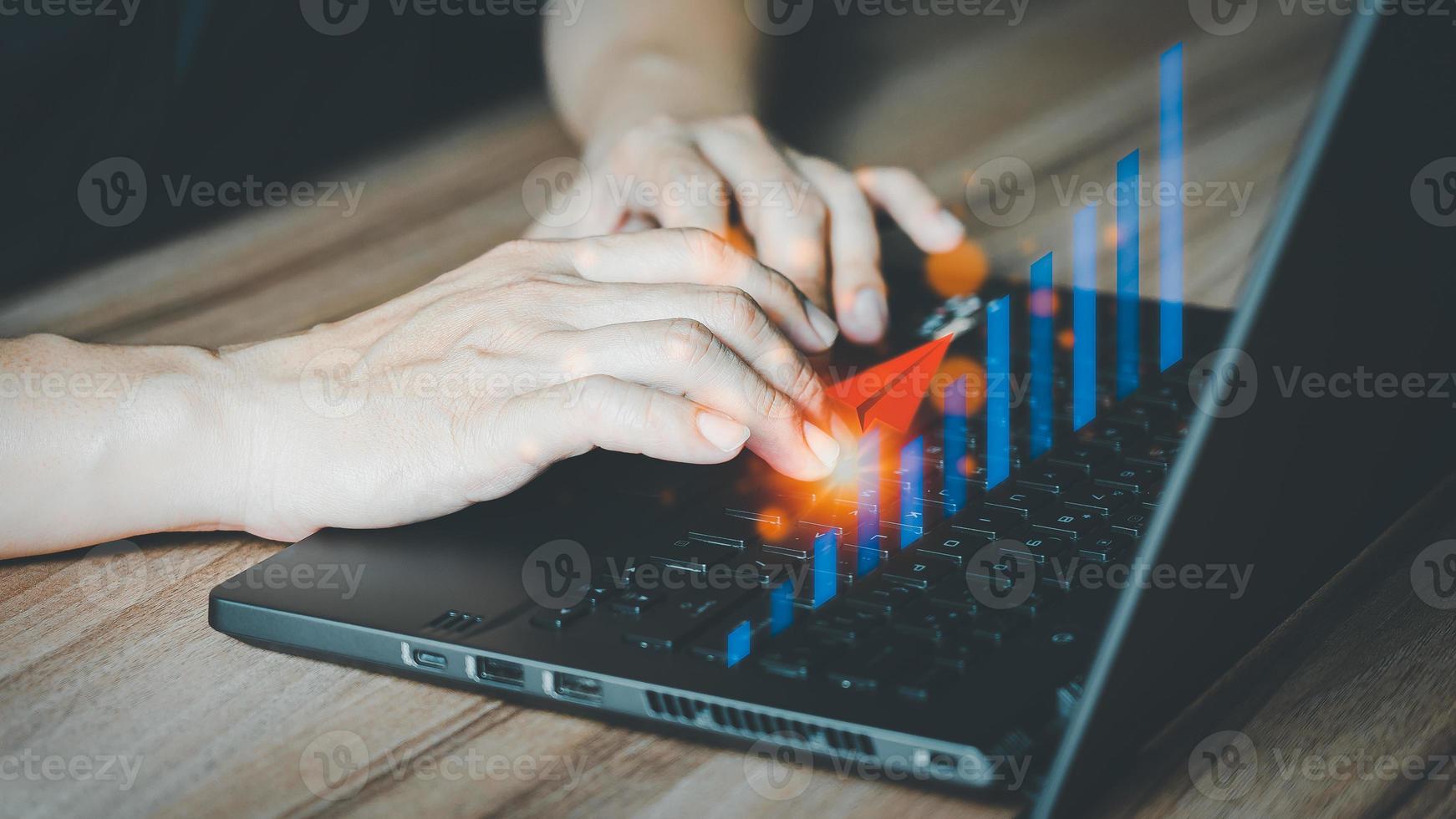 Charts from laptop with analysis of financial, technology, banking and investment concepts, businessman use laptop computer to work. photo