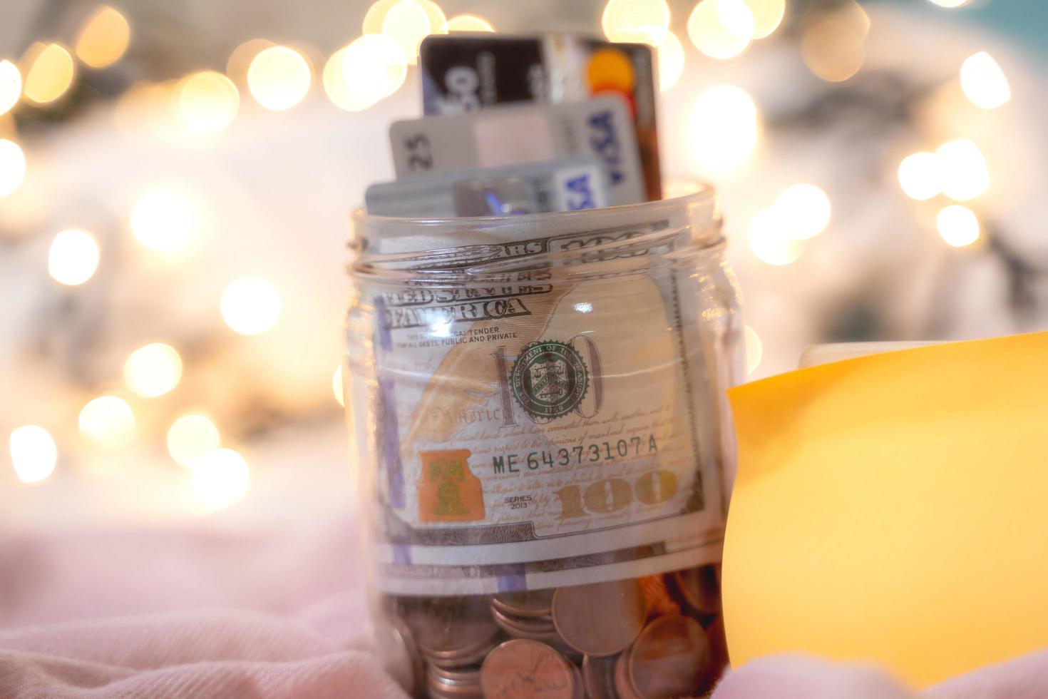 The  pocket money collected in the  Credit card Visa - Mastercard with100 dollar bills money saving growth to profit concept investment and finance business photo