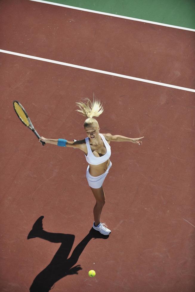 young woman play tennis outdoor photo