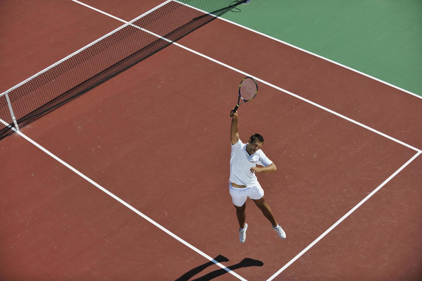 young man play tennis photo