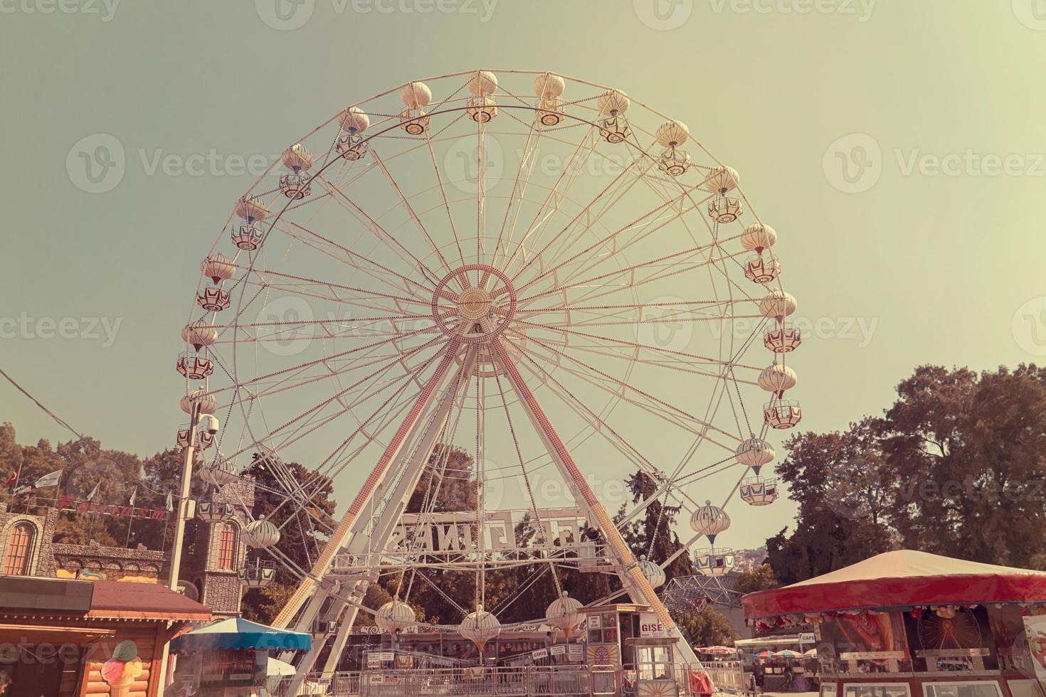 Ferris wheel on the background of blue sky photo