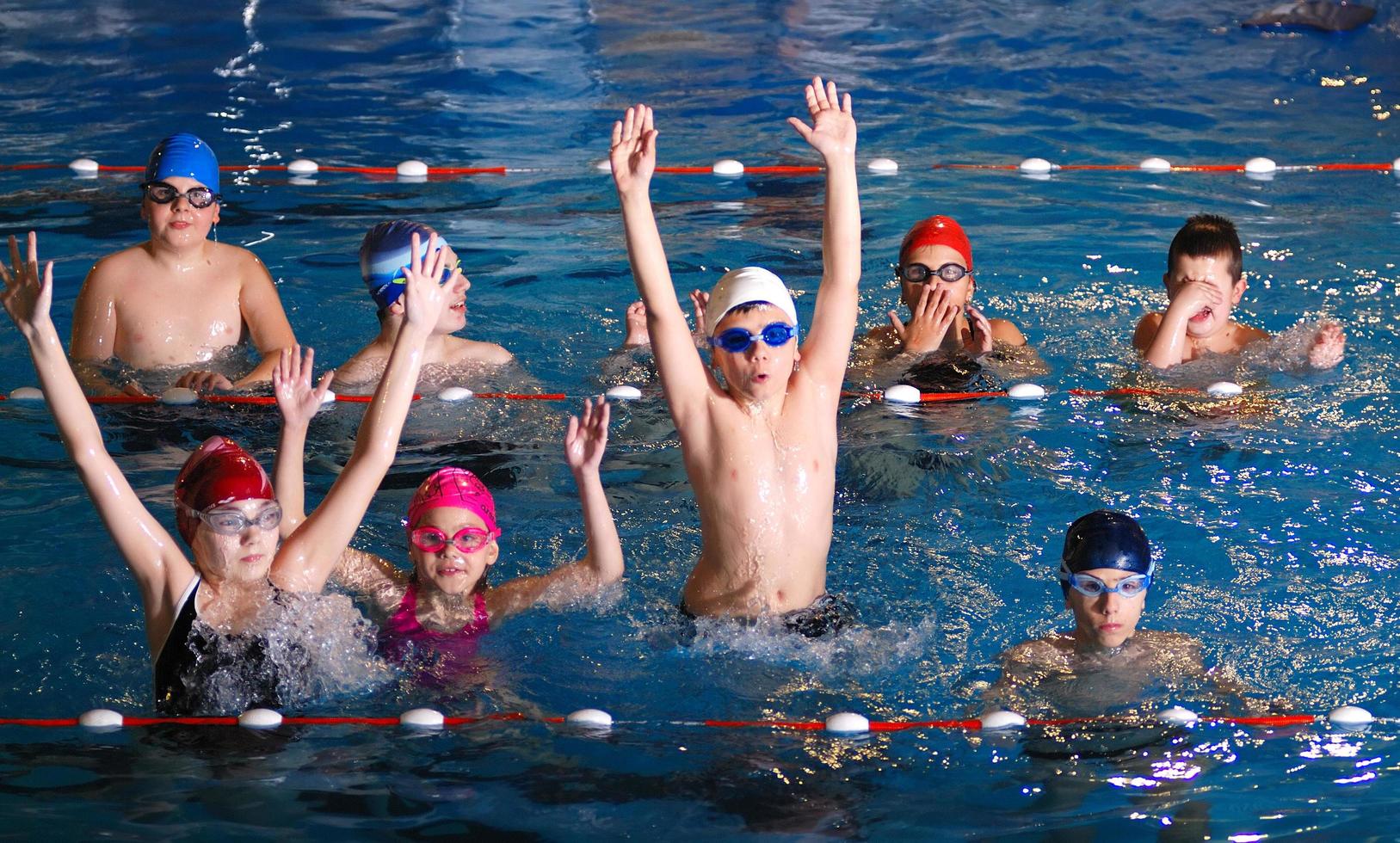 .childrens having fun in a swimming pool photo
