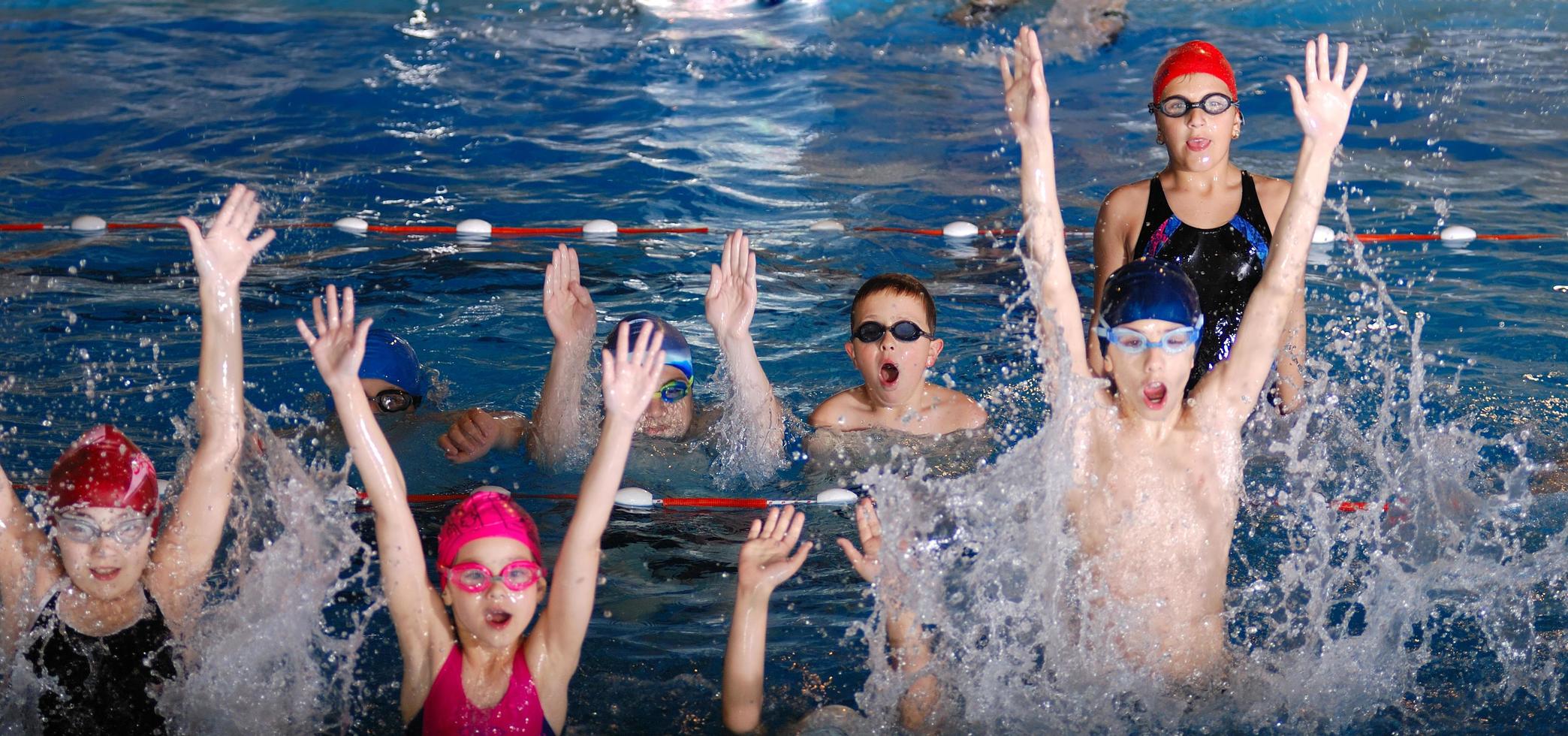 .childrens having fun in a swimming pool photo