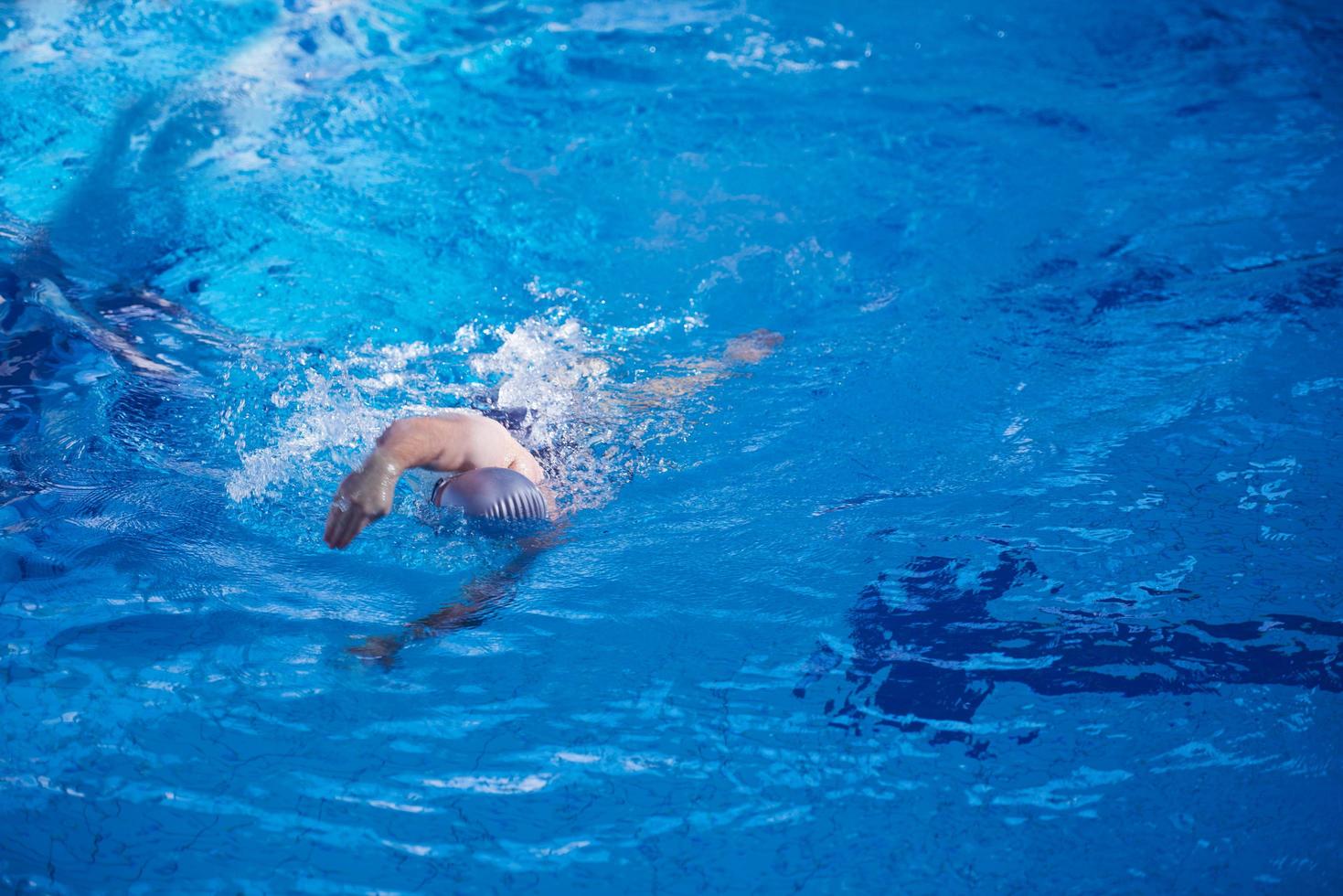 swimmer excercise on indoor swimming poo photo