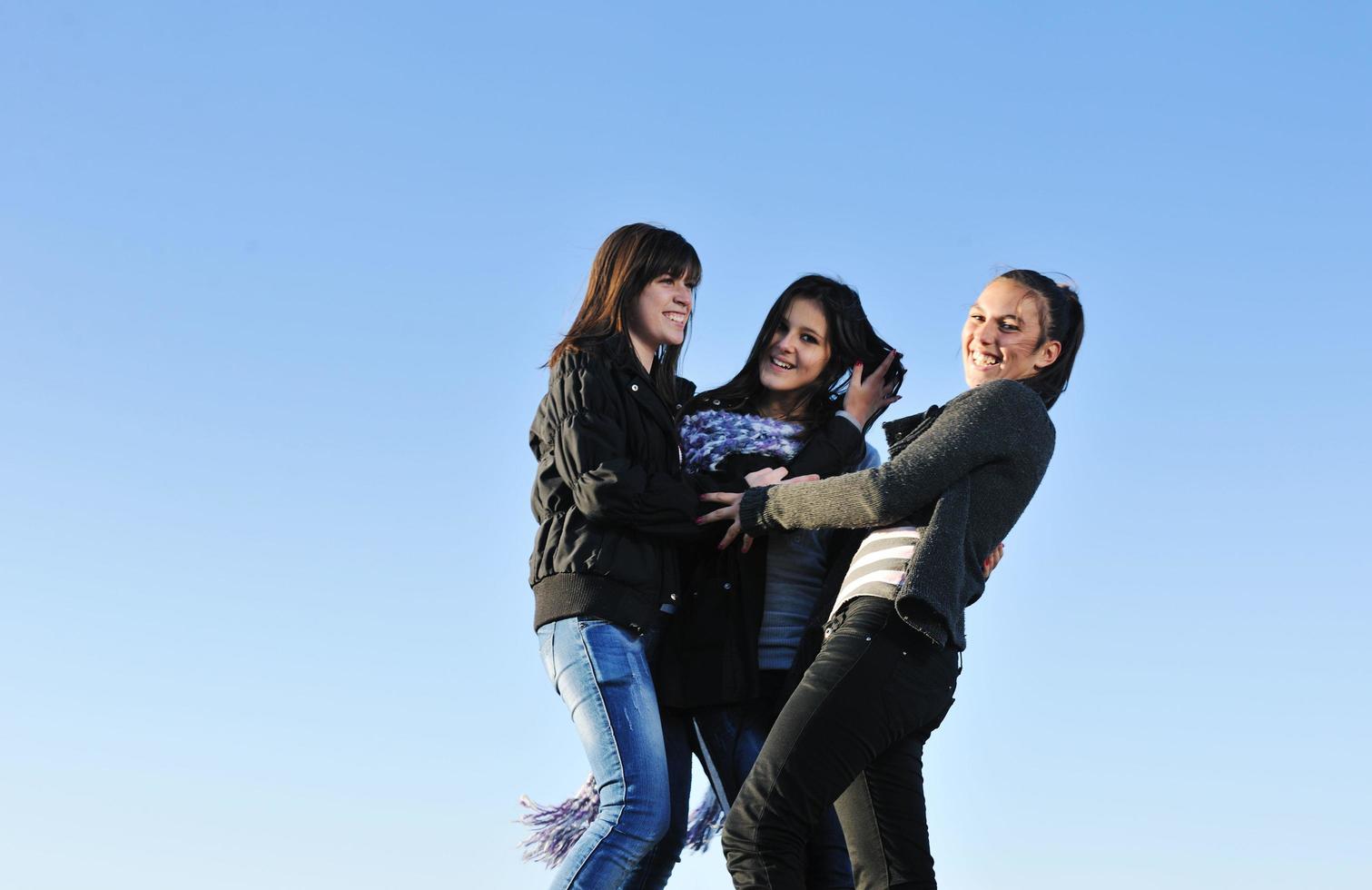 group of teens have fun outdoor photo