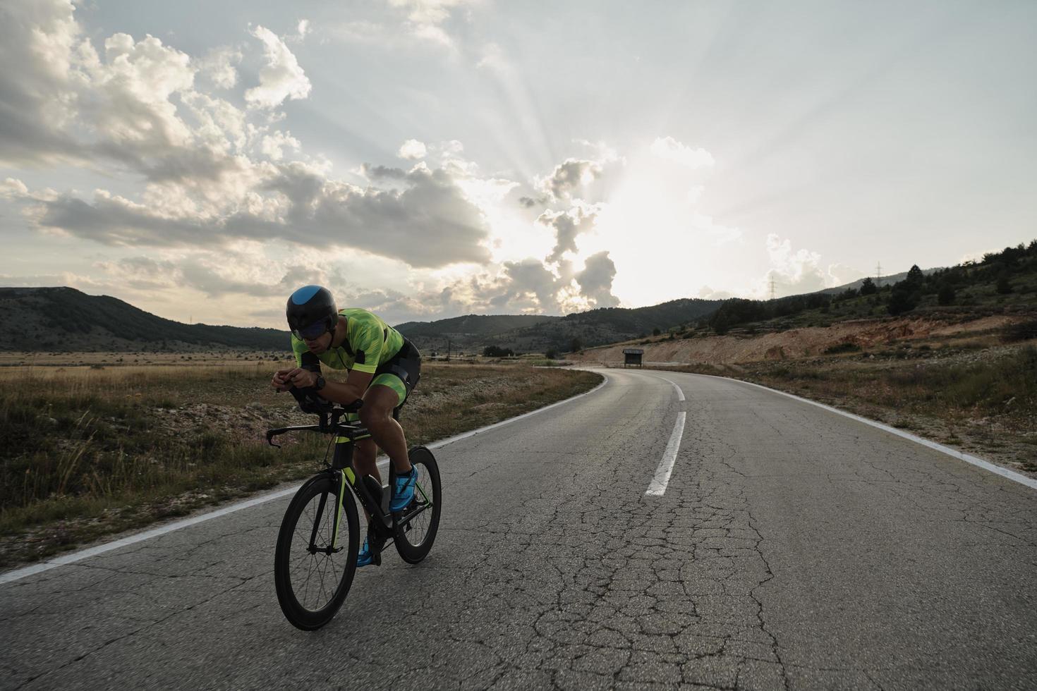 triathlon athlete riding bike photo