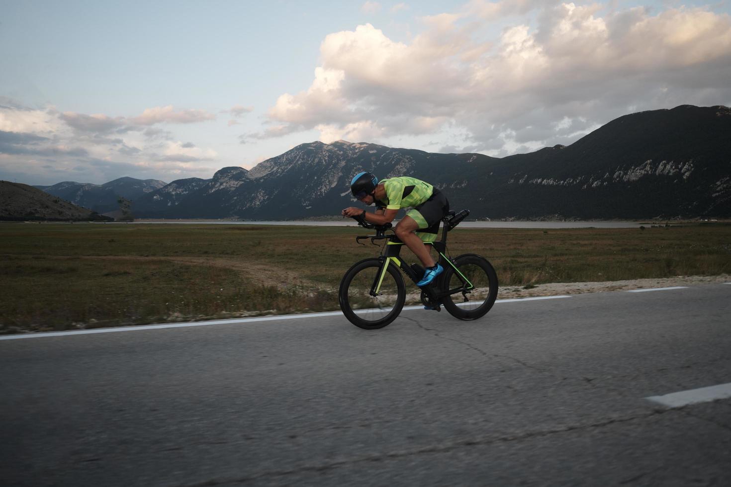 triathlon athlete riding bike photo