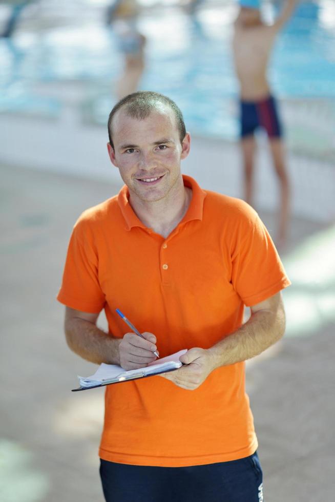happy children group  at swimming pool photo