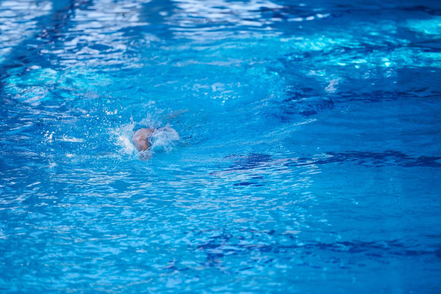 swimmer excercise on indoor swimming poo photo