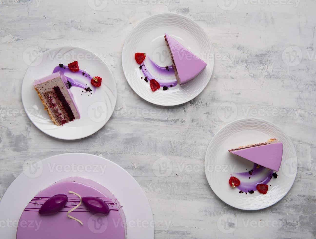 A top view shot of purple cake sliced on a white plates photo