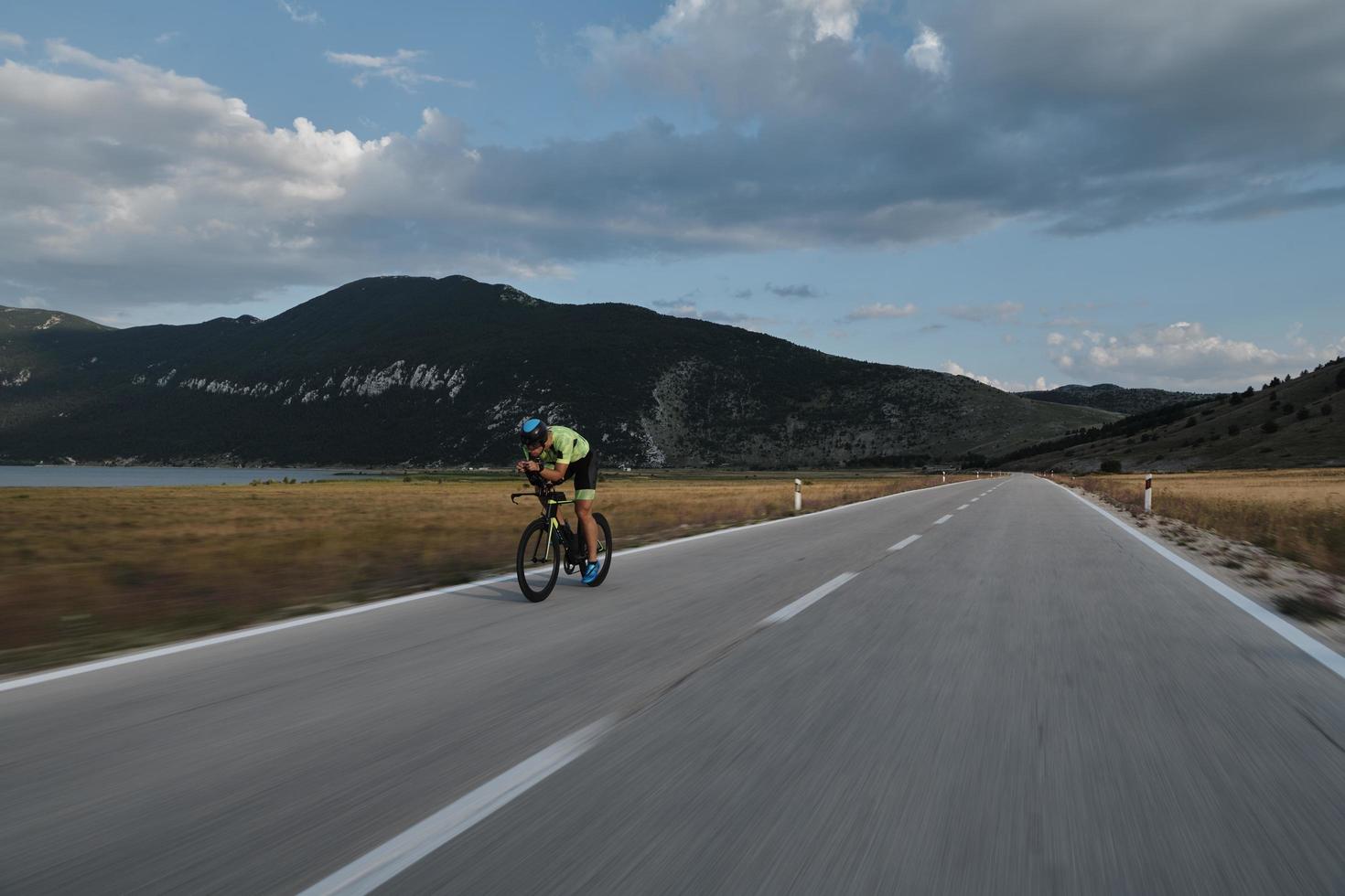 triathlon athlete riding bike photo