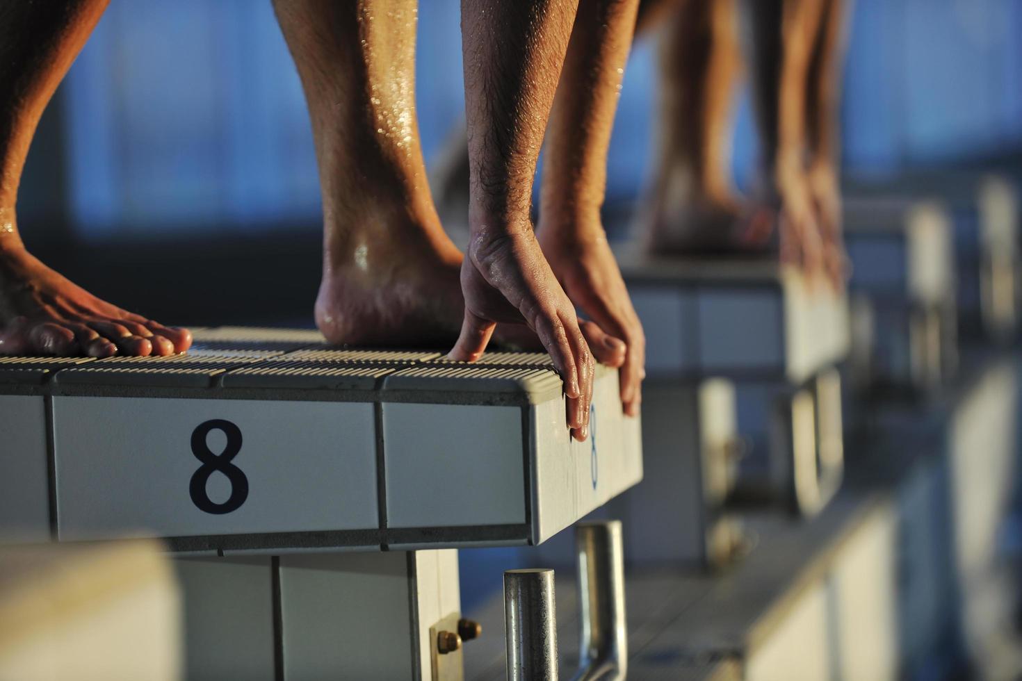 young swimmmer on swimming start photo