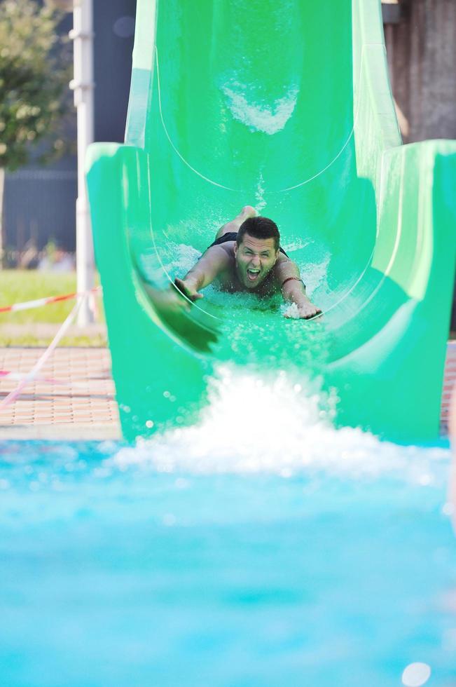 water slide fun on outdoor pool photo