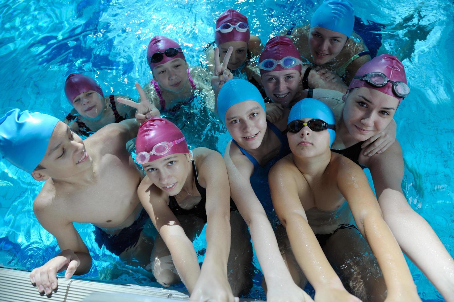 happy children group  at swimming pool photo