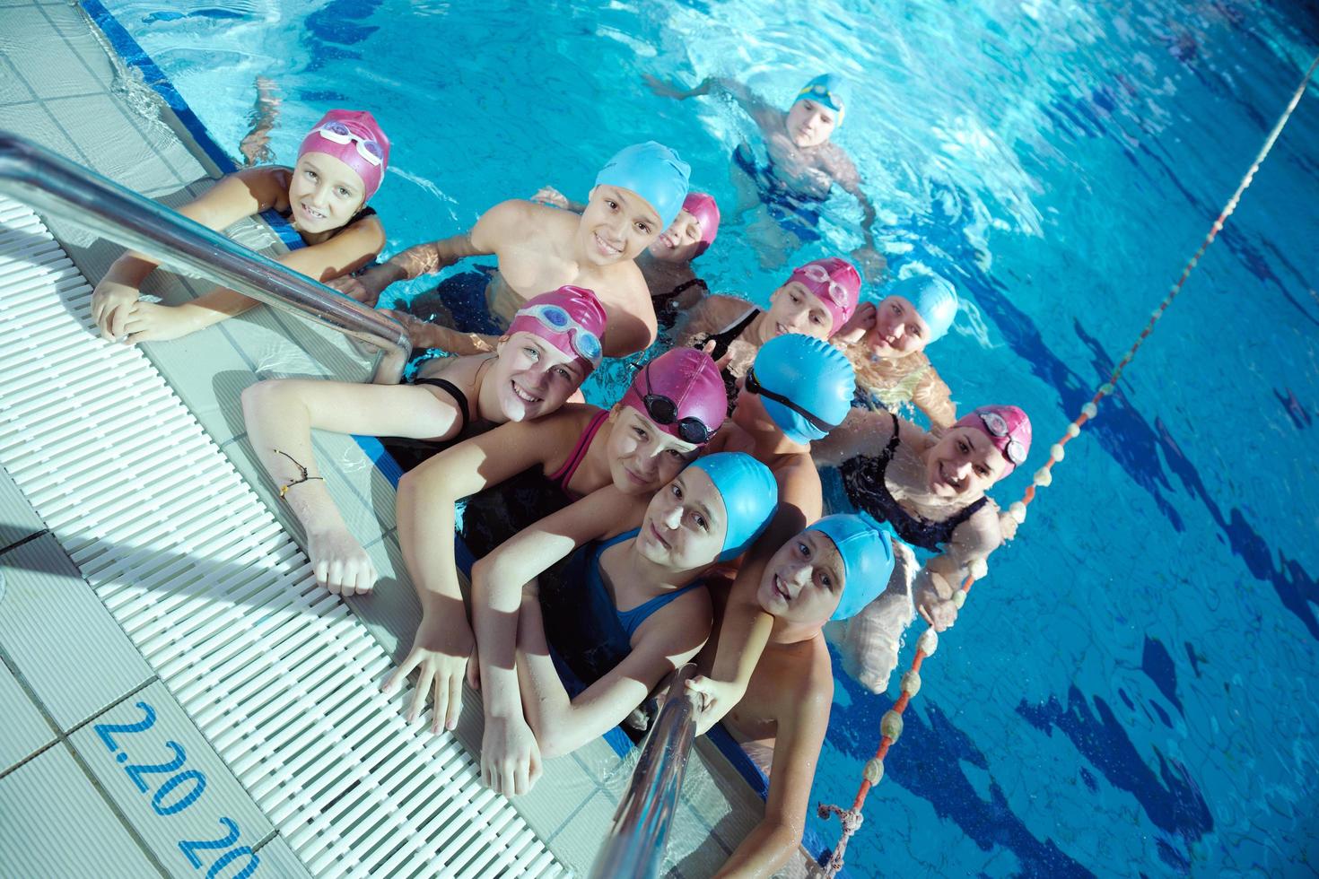 happy children group  at swimming pool photo