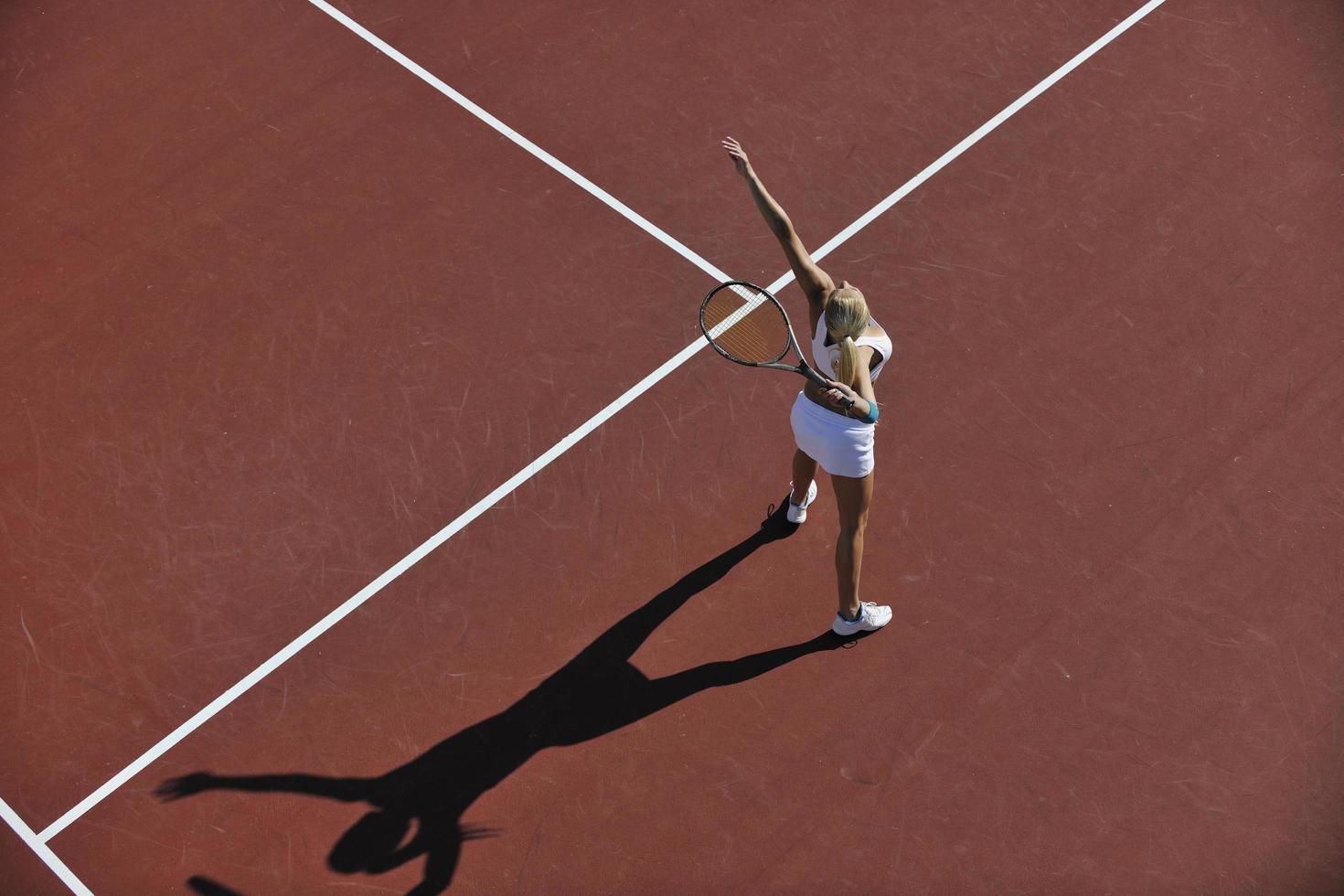 young woman play tennis outdoor photo