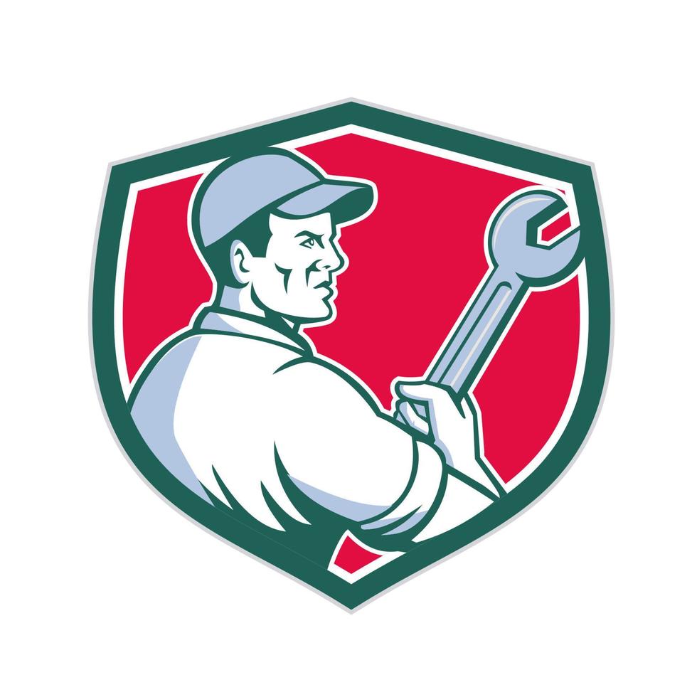 Mechanic Holding Monkey Wrench Shield Retro vector