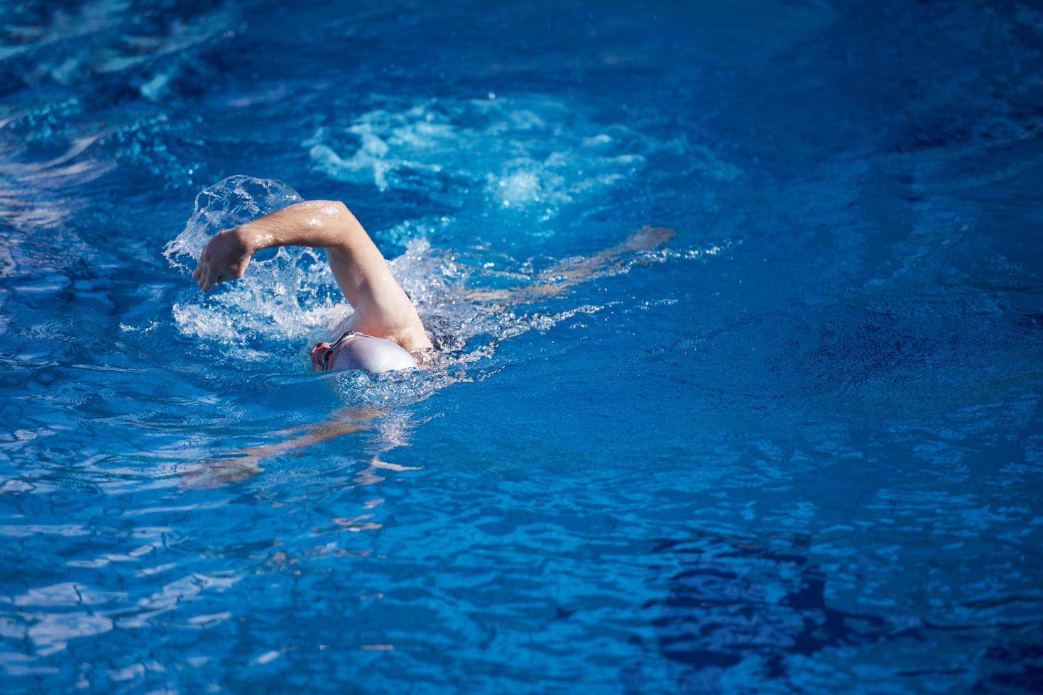 swimmer excercise on indoor swimming poo photo