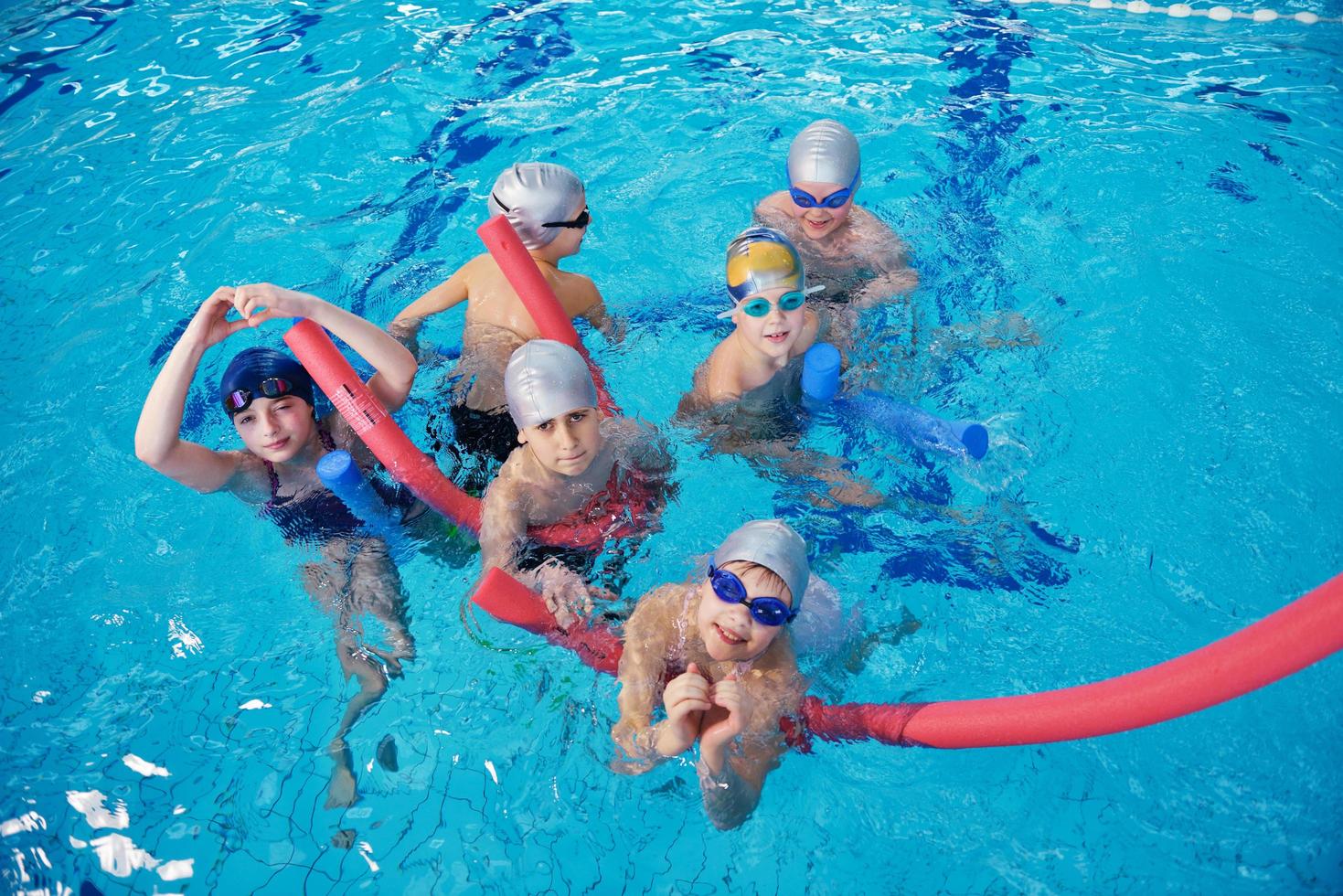 happy children group  at swimming pool photo