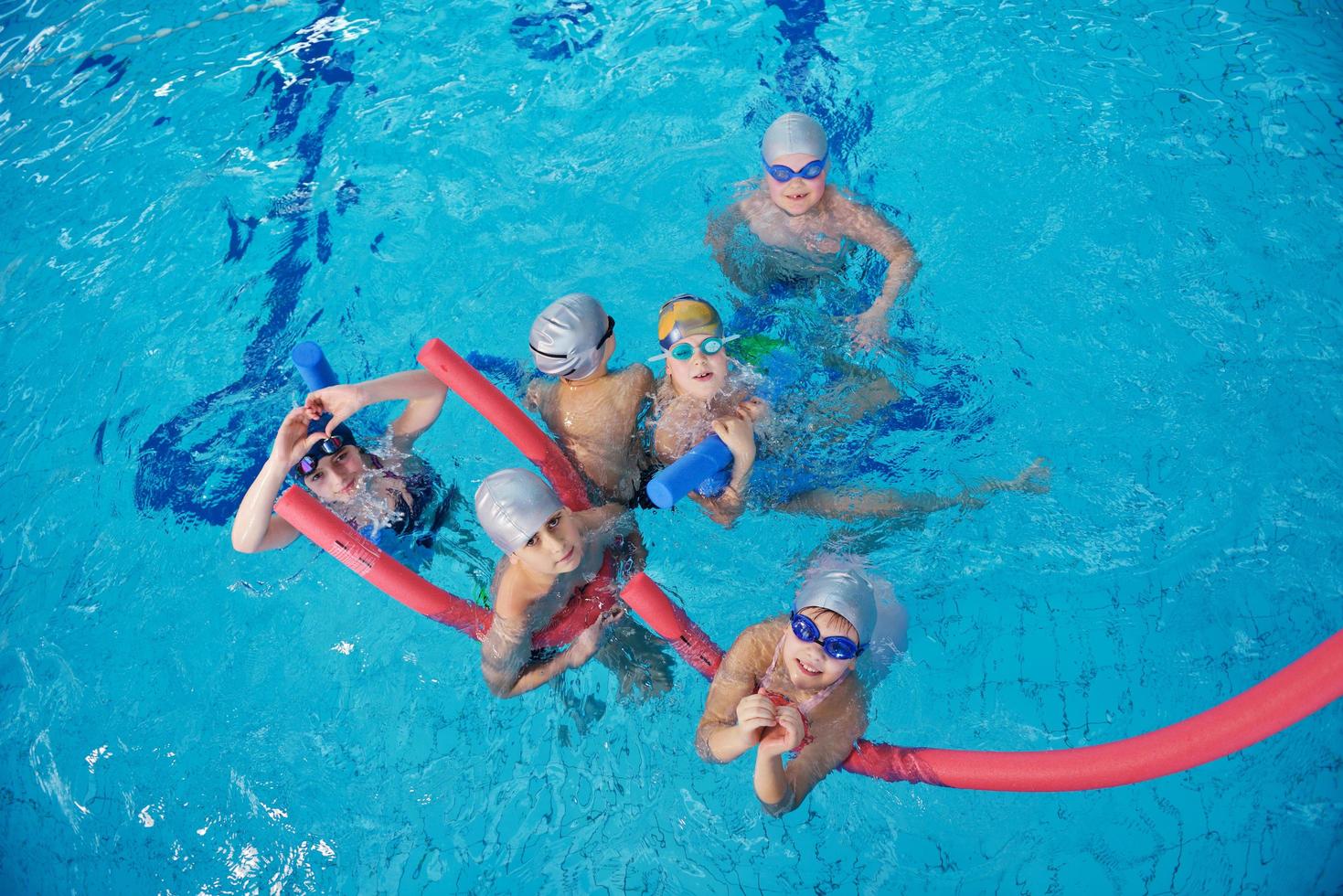 happy children group  at swimming pool photo