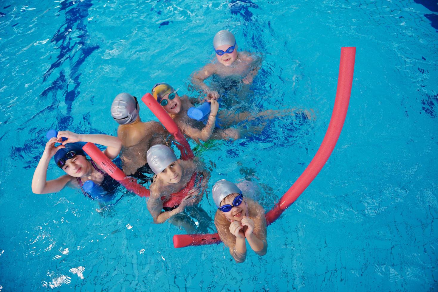 happy children group  at swimming pool photo